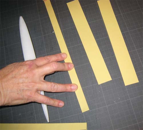 Cutting and folding of overhang strips